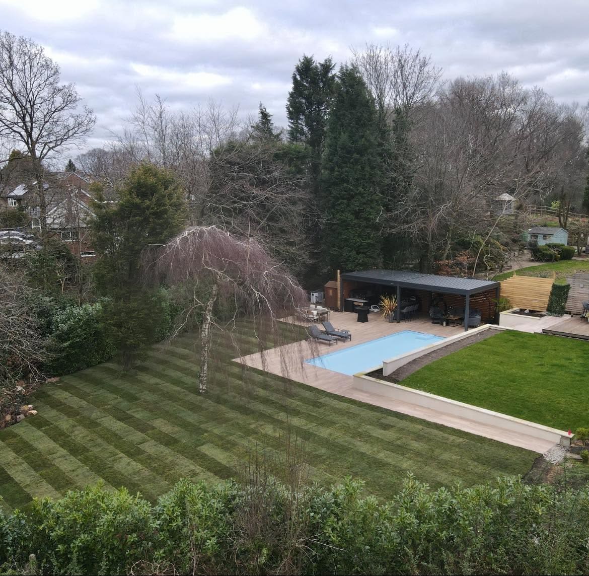 After: large landscaped garden with pool, decking and pergola