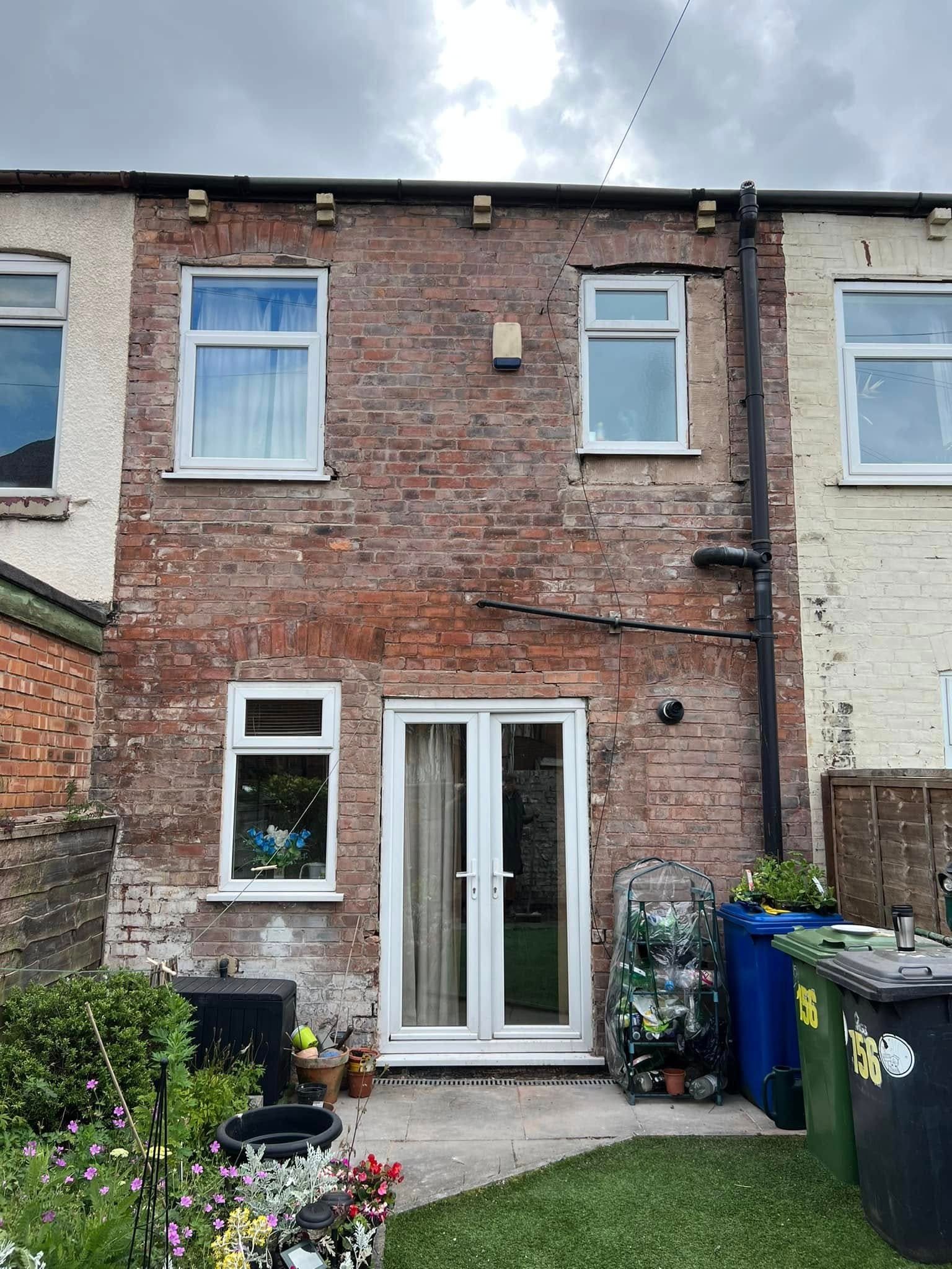 After: repaired brickwork and new upvc doors on rear extension