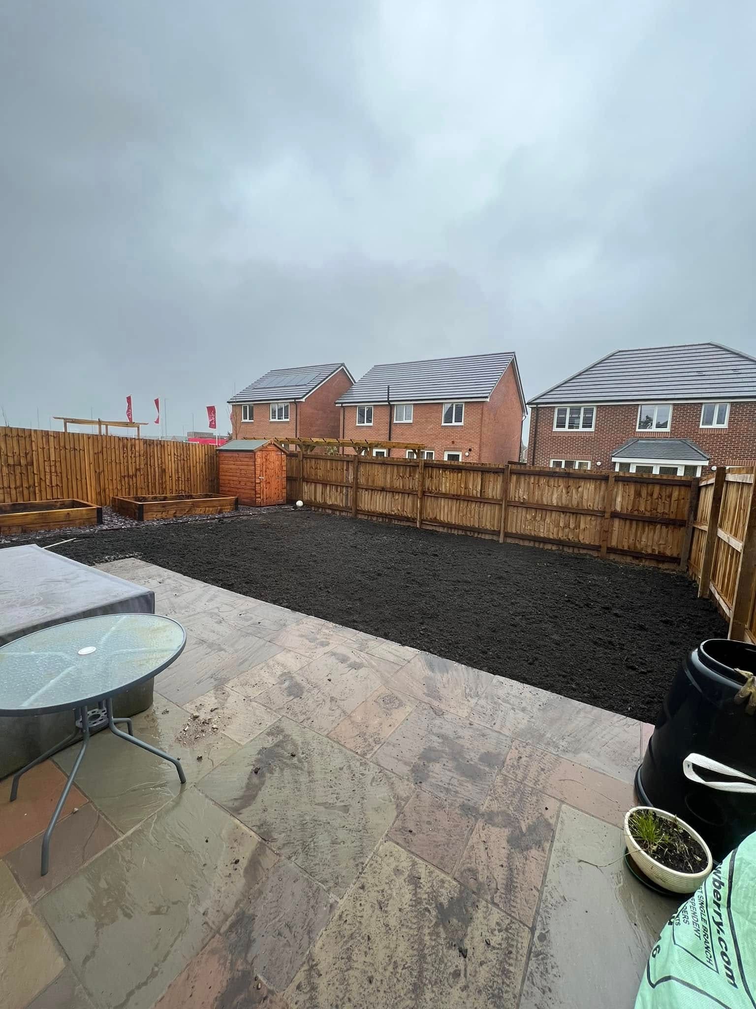 Before: bare soil garden on a new build property