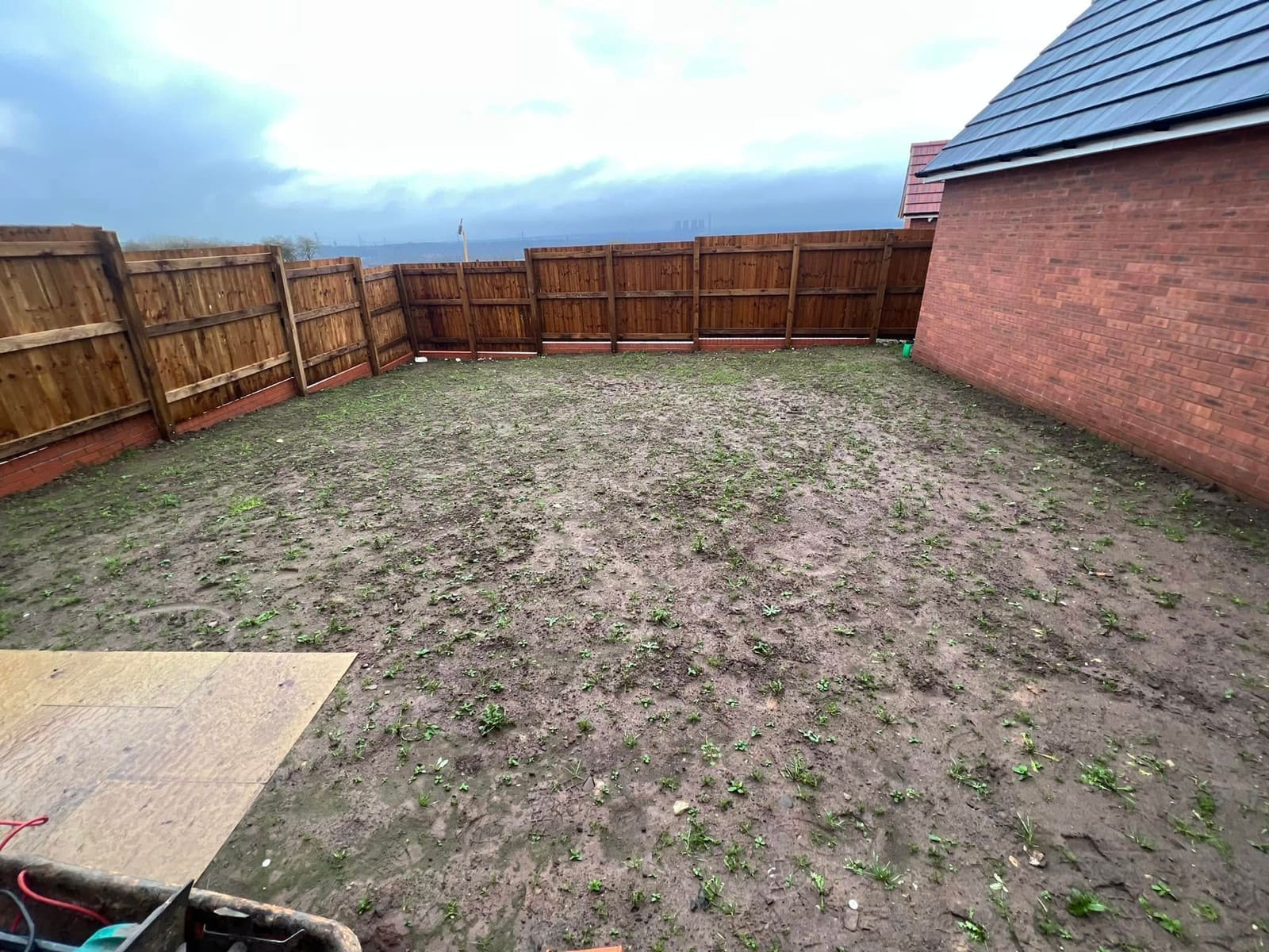 Before: bare rear garden plot