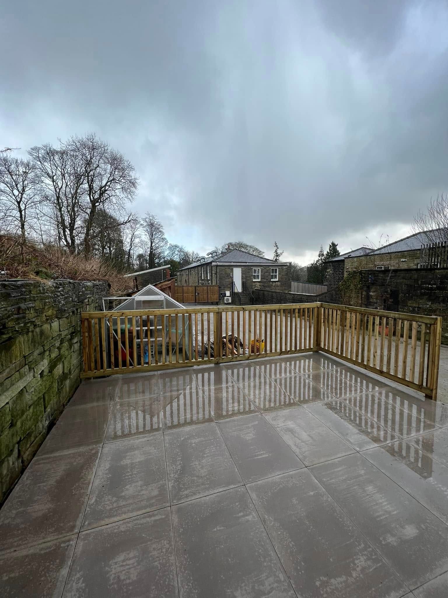 Sandstone paved patio in a rear terrace garden