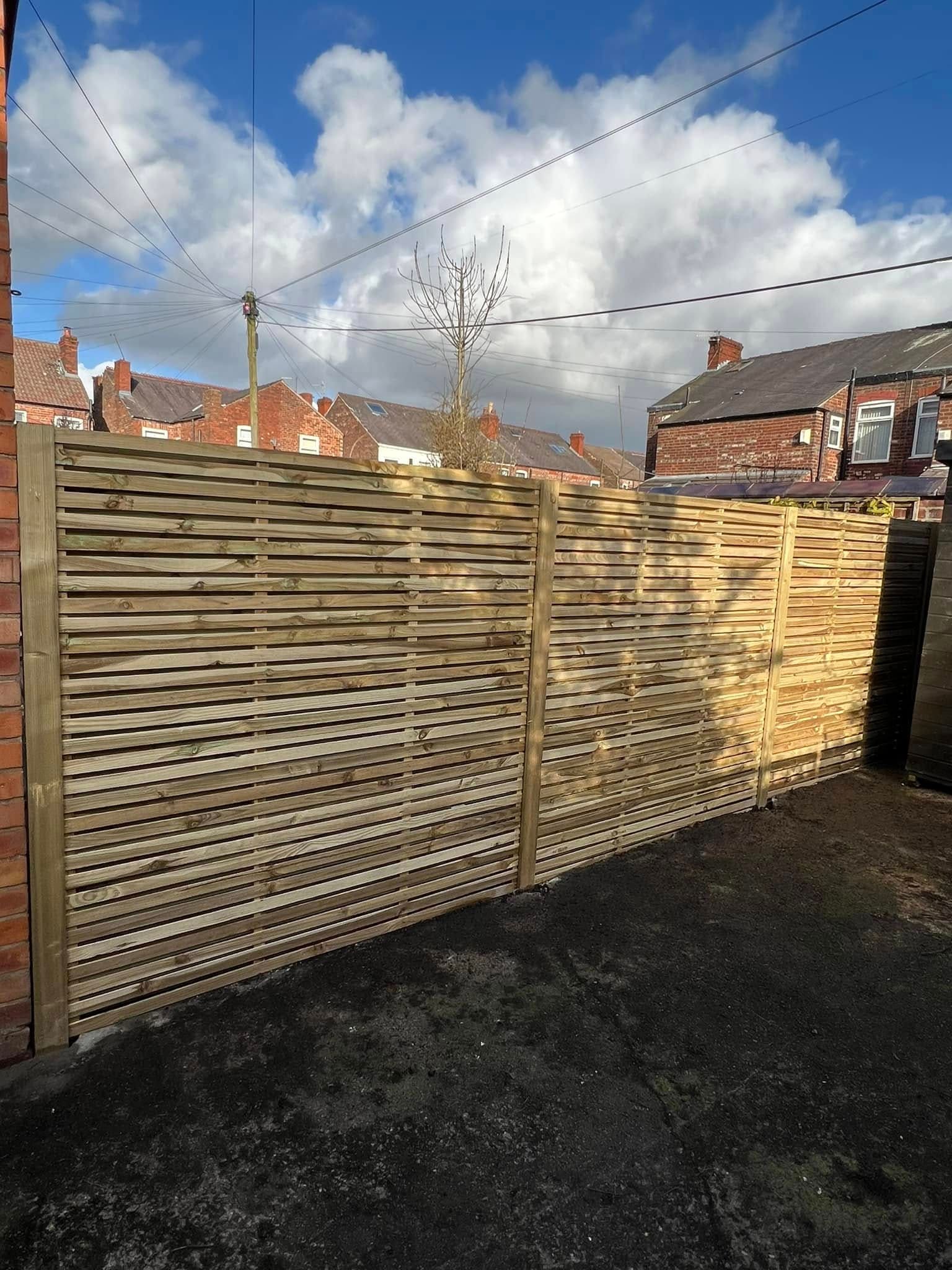Stone-walled patio and decking area